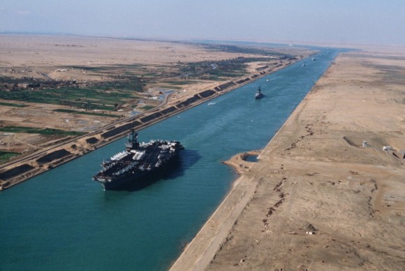 An aerial port bow view of the aircraft carrier USS AMERICA (CV 66) during its transit through the canal.