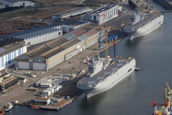 The two Mistral-class helicopter carriers Sevastopol (Bottom) and Vladivostok are seen at the STX Les Chantiers de l'Atlantique shipyard site in St.-Nazaire, France, May 25, 2015. REUTERS Stephane Mahe